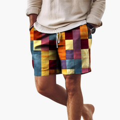 Herren Badeshorts mit elastischem Bund und mehrfarbigem Blockmuster in Orange