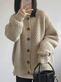 Damen Strickjacke mit Rundhalsausschnitt Knopfverschluss Ballonärmeln und Strukturmuster in Aprikose